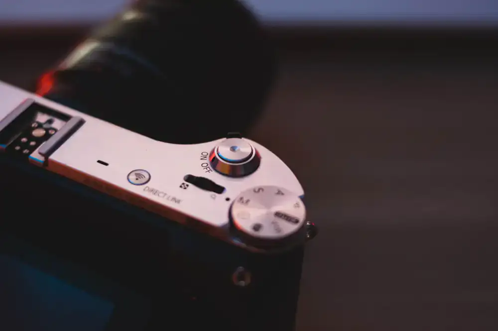 Close-up of a professional camera lens and mechanical dials