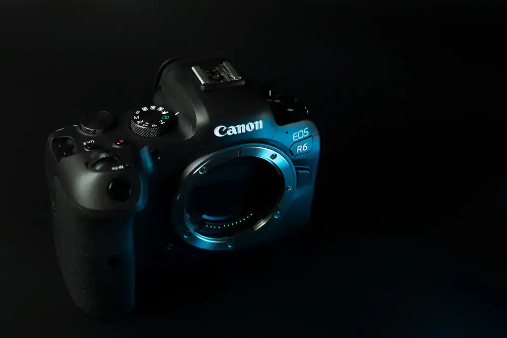 Premium mirrorless camera body sitting on a studio table